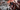 Promotional artwork for a video game or media title showing a circular 'Coming Soon Next Week' badge over a dramatic sci-fi battle scene with armored characters holding weapons in a fiery, war-torn environment.